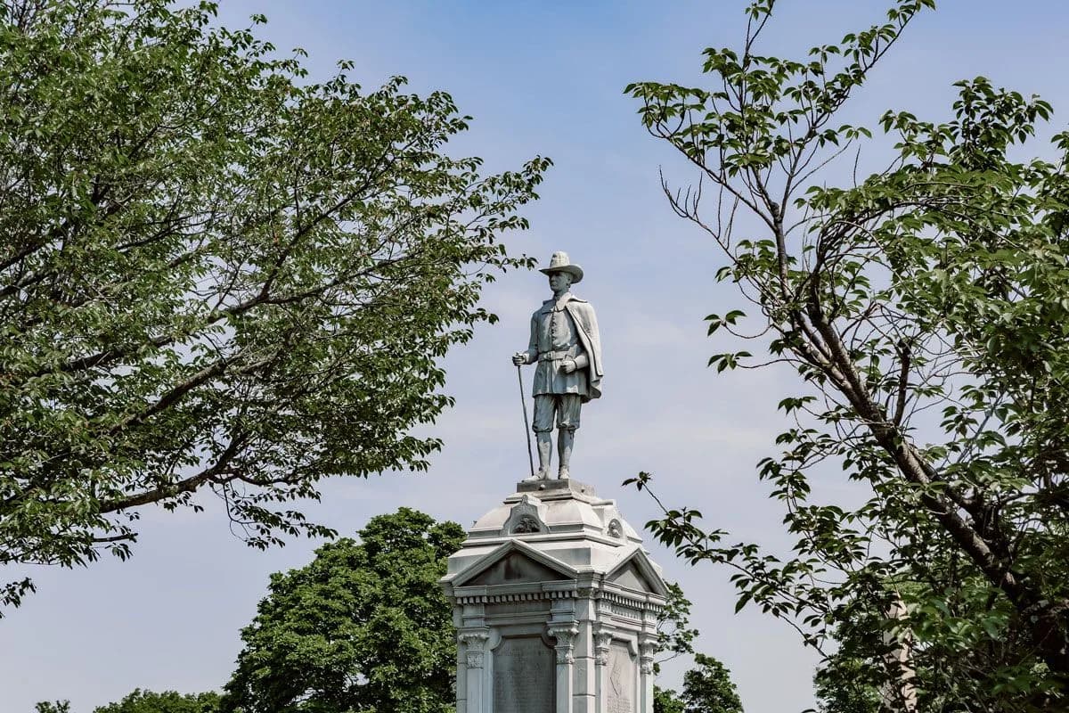 A Civil War soldier statue atop a monument at Fairmount Cemetery.