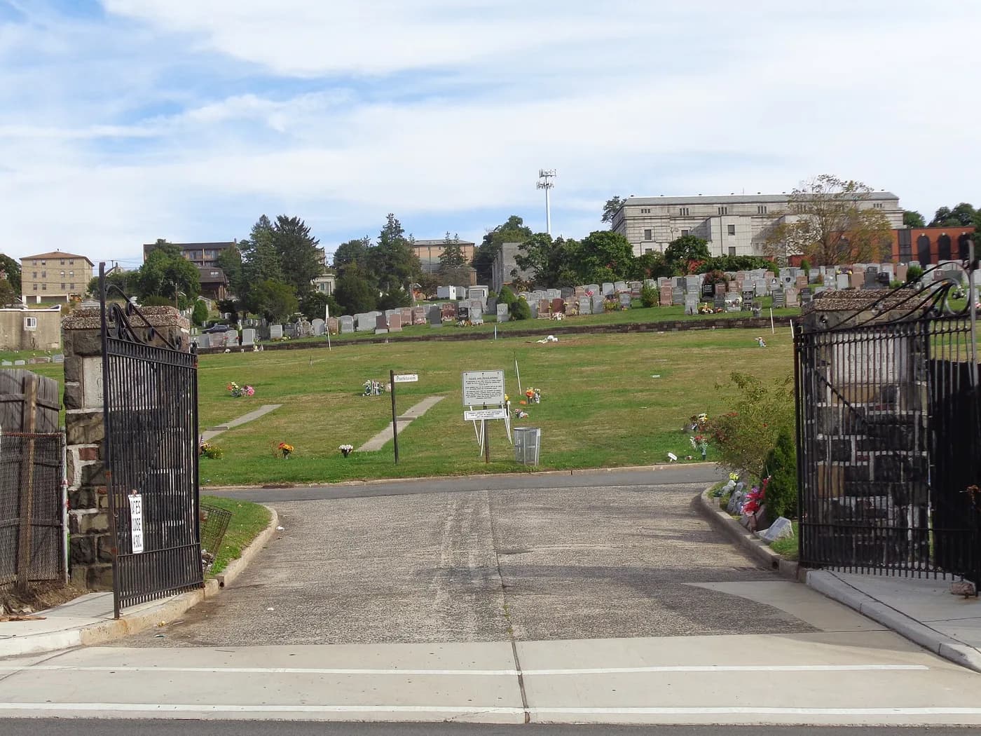 The open entrance gates and drive into Fairview Cemetery.