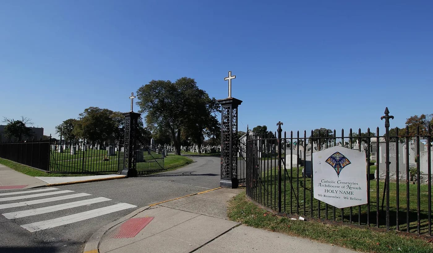 The iron entrance gates of Holy Name Cemetery on West Side Avenue.