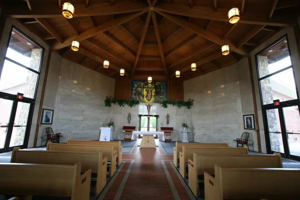 The chapel inside the mausoleum at New St. Mary Cemetery, with pews facing the altar.