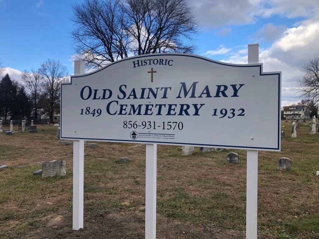 The sign for the historic Old Saint Mary Cemetery at the edge of the grounds.